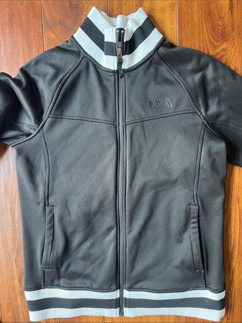 The North Face Kids Black Jacket with White Trim